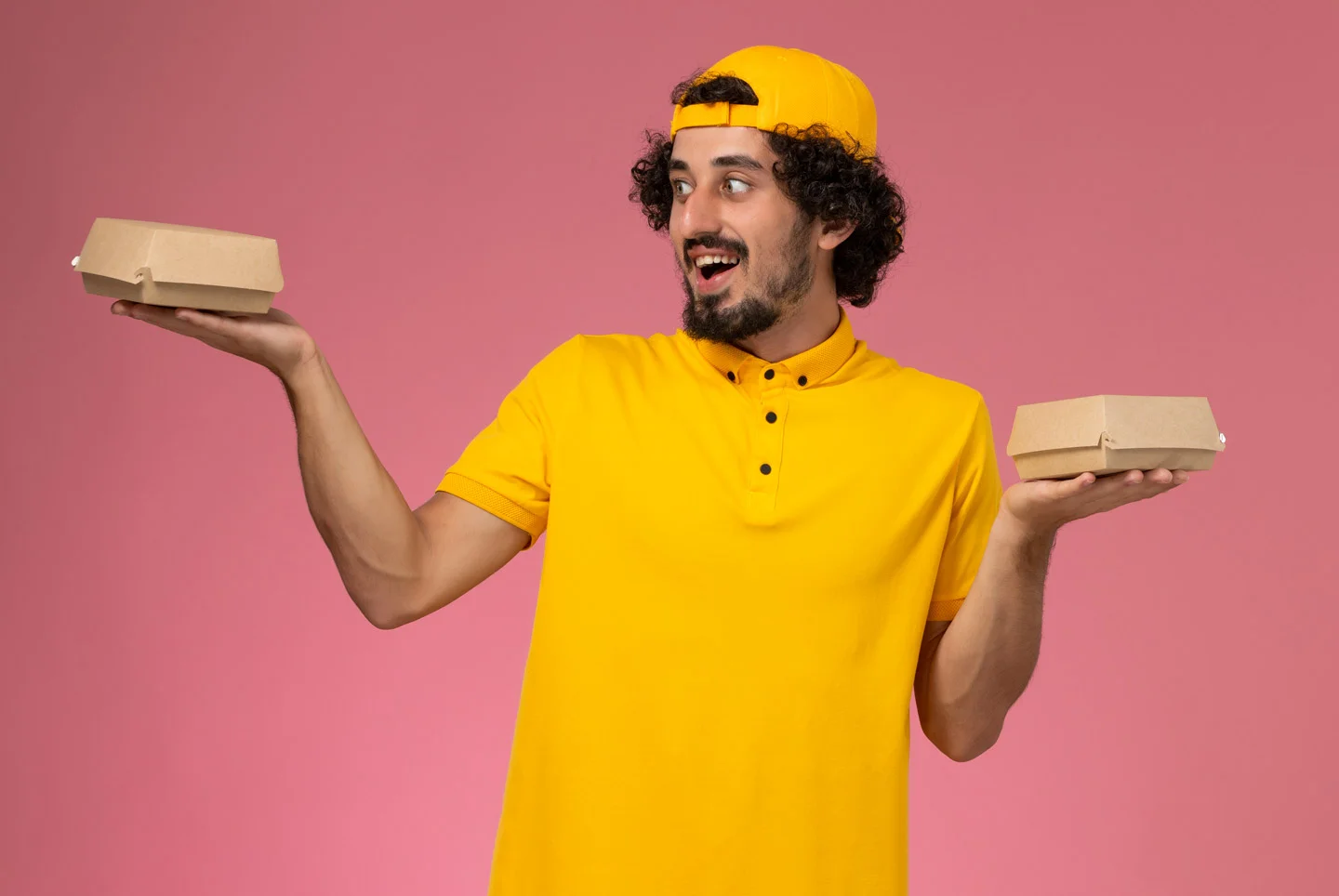 delivery boy displaying biryani packaging box